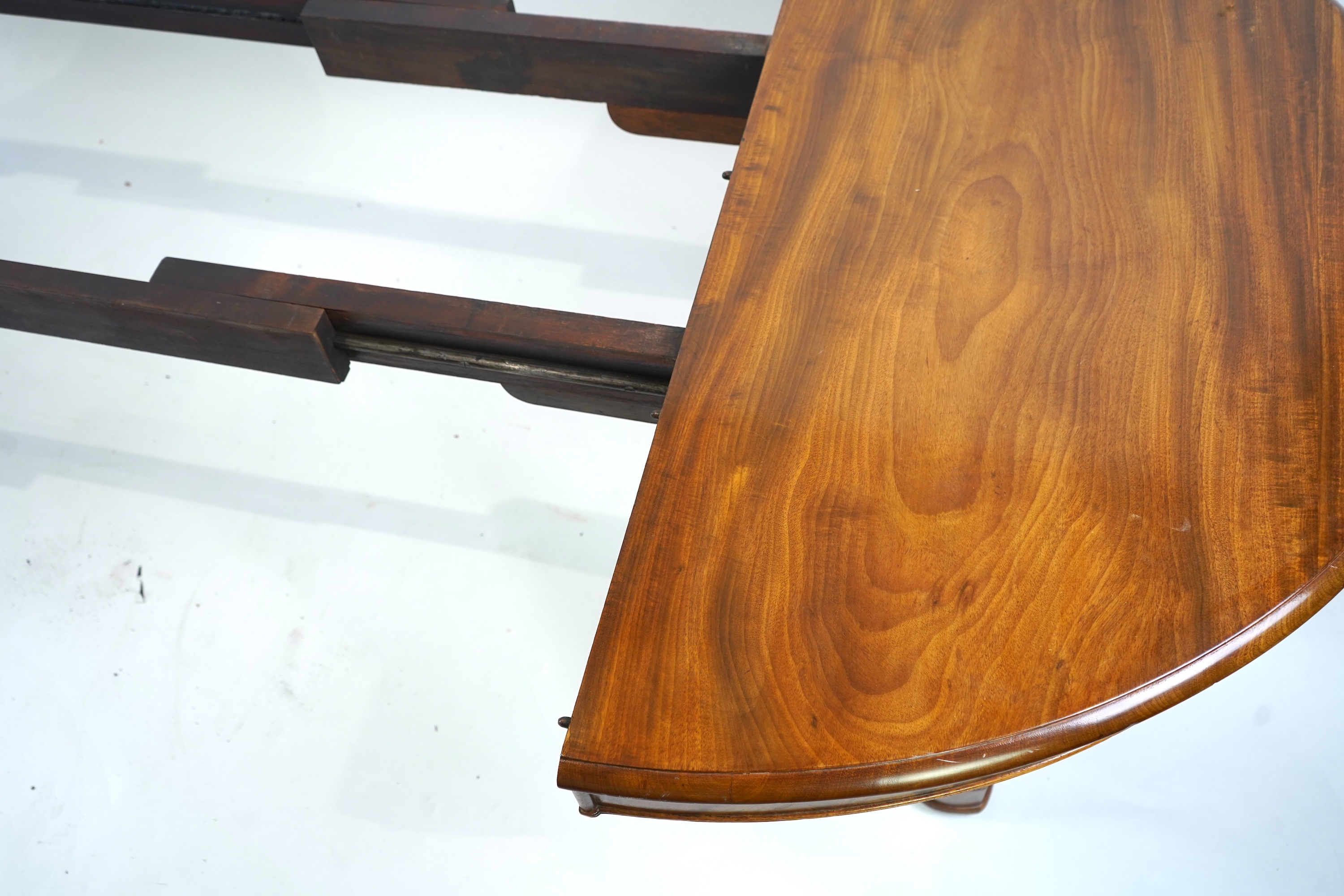 A mid 19th century Continental mahogany extending dining table